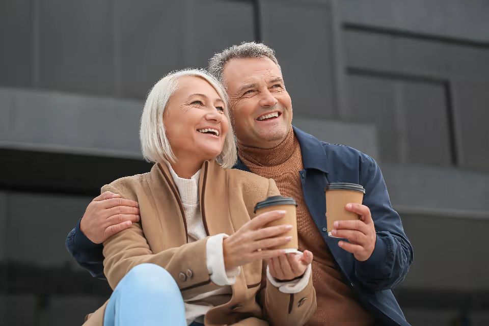 Couple laughing together outdoors